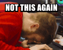 A person bangs their head against a keyboard. Text across the top of gif read, ‘not this again’.